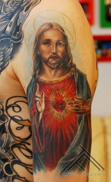 Religious themed colored shoulder tattoo of Jesus