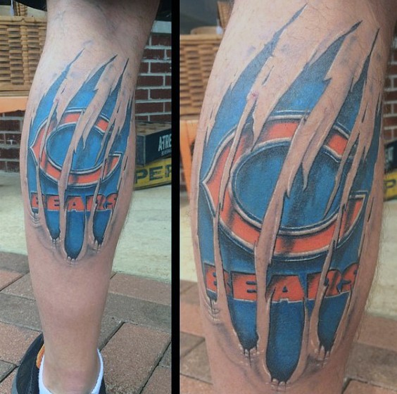 Ripped skin style colored leg tattoo of sports team emblem