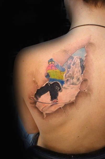 Ripped skin style colored scapular tattoo of amazing snowboarder