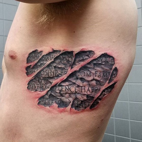Ripped skin style colored side tattoo of old lettering
