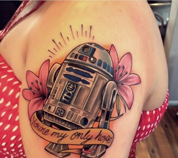 Romantic style colored big R2D2 droid tattoo on shoulder stylized with flowers and lettering