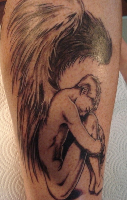Sad crying angel tattoo