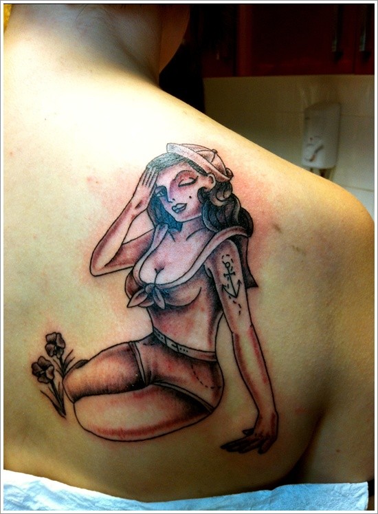 Sailor pin up girl tattoo on shoulder blade
