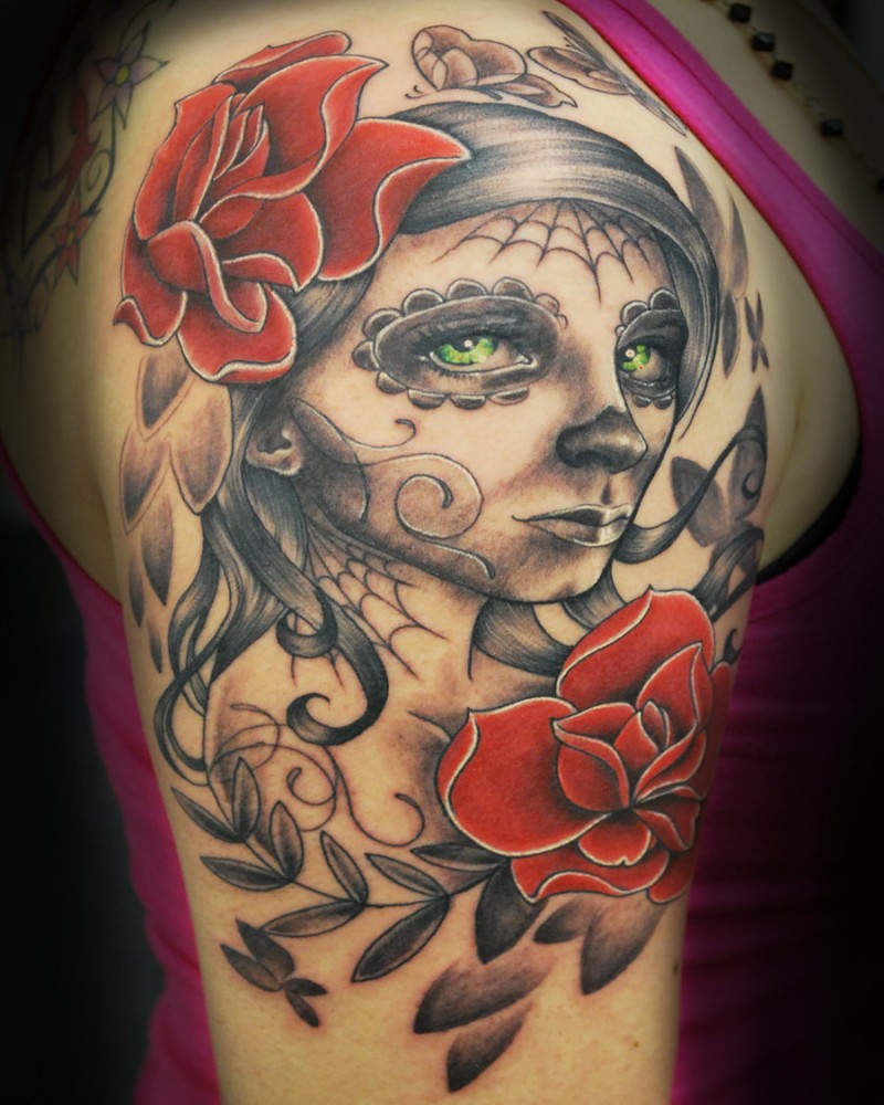 Santa muerte girl with green eyes and red roses tattoo