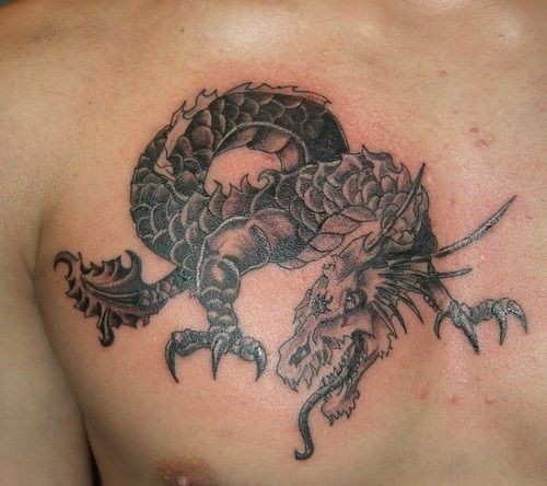 Scaly black dragon tattoo on chest