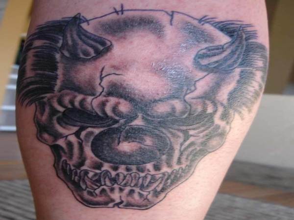 Scary skull clown with horns tattoo