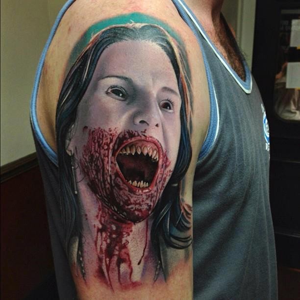 Scary vampire bleeding girl tattoo on half sleeve