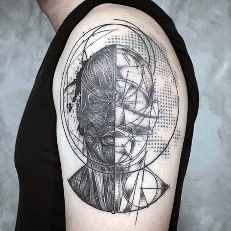 Scientific style black and white man tattoo on upper arm