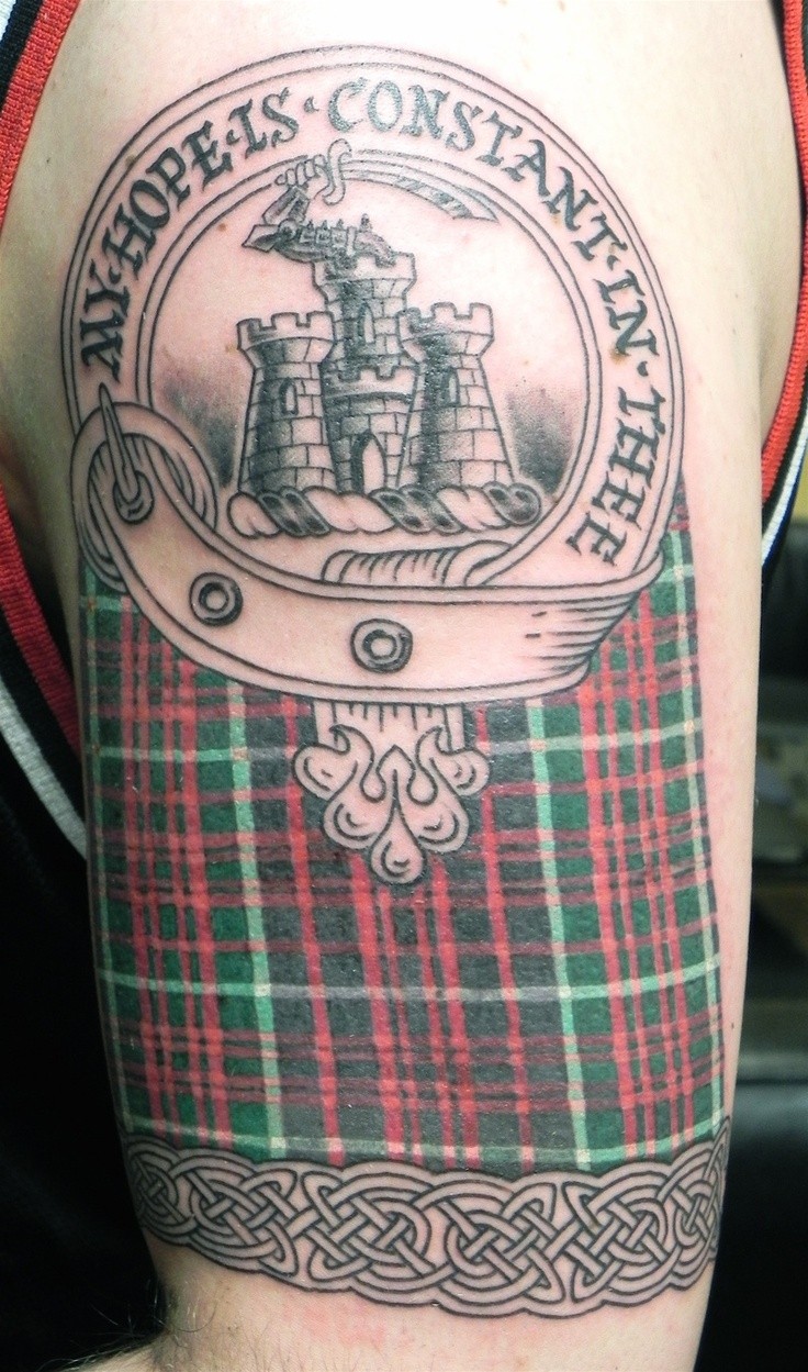 Scotland tattoo with castle on shoulder
