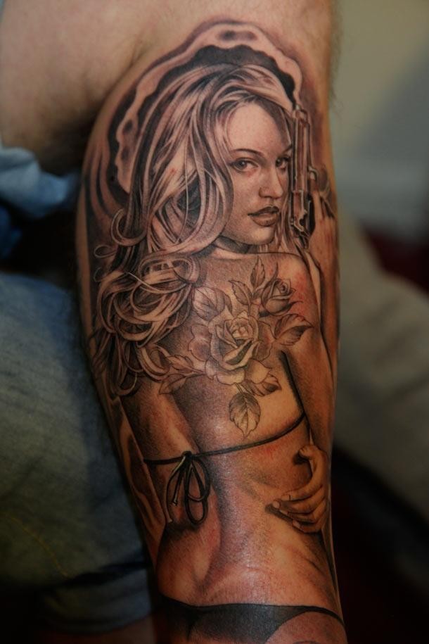 Sexy pin up girl with a pistol and tattoo by Jose Lopez