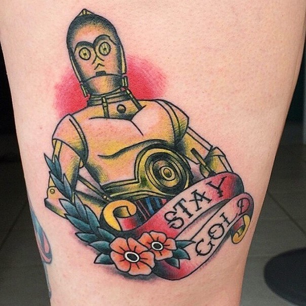 Sharp cartoon like designed C3PO tattoo on thigh with lettering and flowers