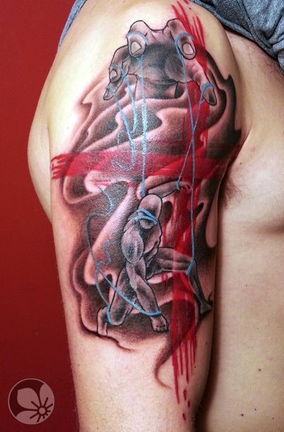 Sharp designed and colored mystical bloody tattoo on shoulder