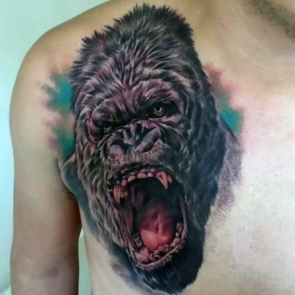 Sharp designed and detailed colored roaring gorilla tattoo on chest