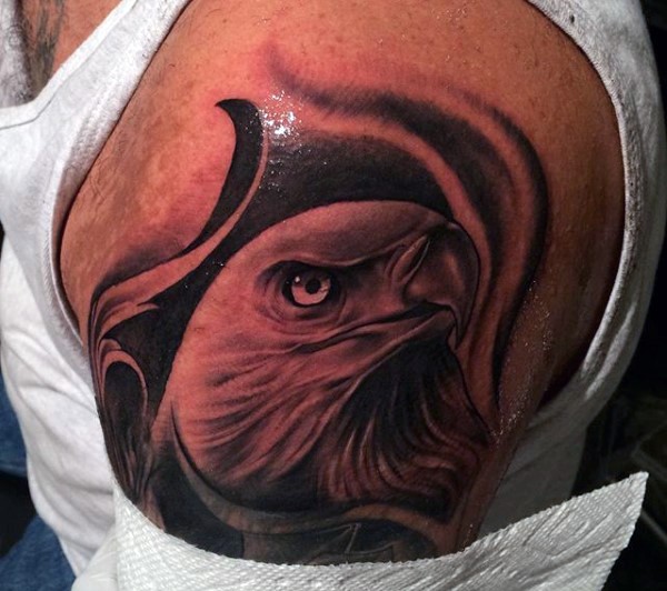 Sharp designed and painted detailed black and white eagle shoulder tattoo