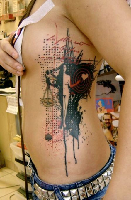 Sharp designed and painted mystical puzzle like tattoo on side