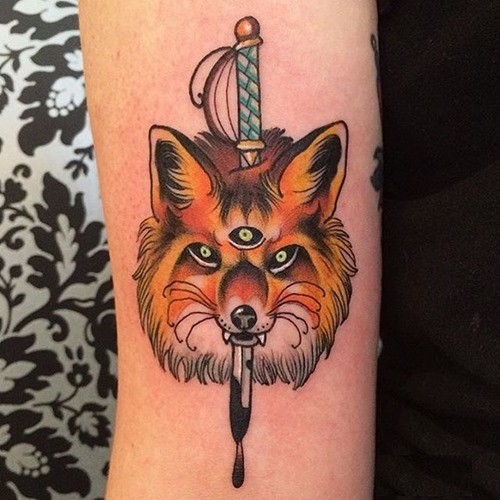 Sharp old school colored mystical fox with tree eyes on arm with bloody sword