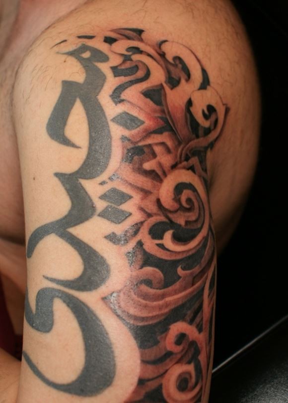 Simple big black ink Hinduism symbols tattoo on shoulder