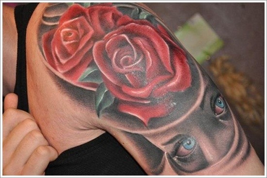 Simple big colored roses shoulder tattoo with mystical face