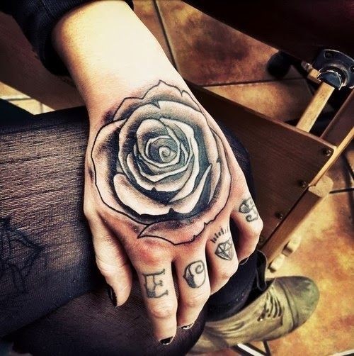 Simple big detailed black ink rose tattoo on arm