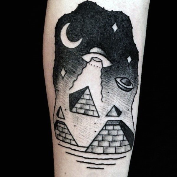 Simple black and white alien ship with pyramids tattoo on arm