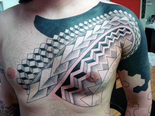 Simple black and white geometrical tattoo on shoulder and chest area