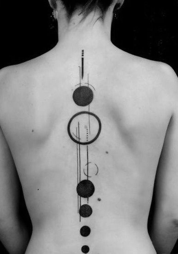 Simple black and white planet parade like tattoo on back