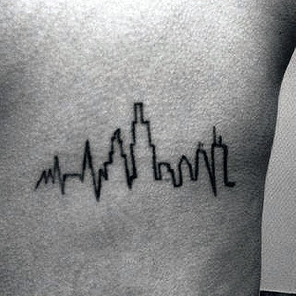 Simple black ink city shaped heart rhythm tattoo on back
