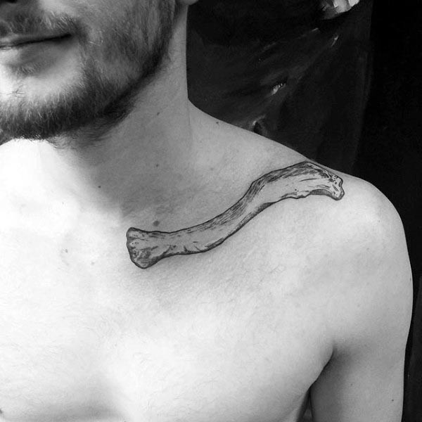 Simple black ink collarbone tattoo of human bone