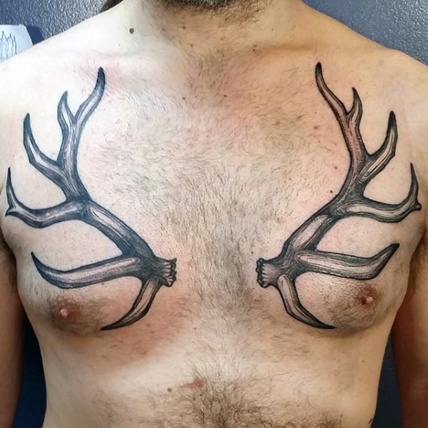 Simple black ink detailed chest tattoo of deer horns