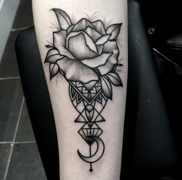 Simple black ink flower tattoo on forearm stylized with beautiful vaze