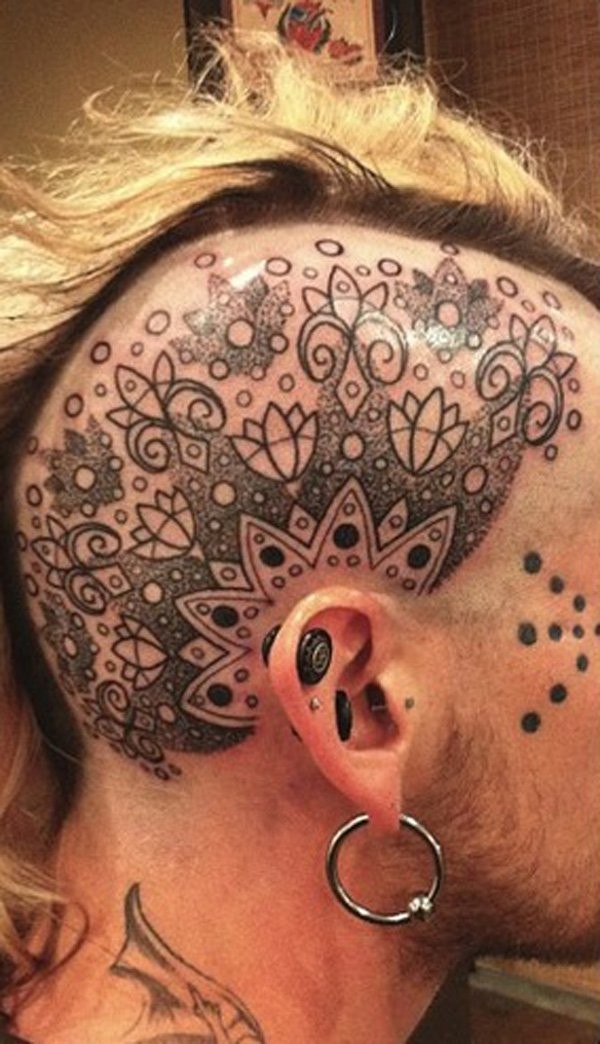 Simple black ink head tattoo of nice ornaments
