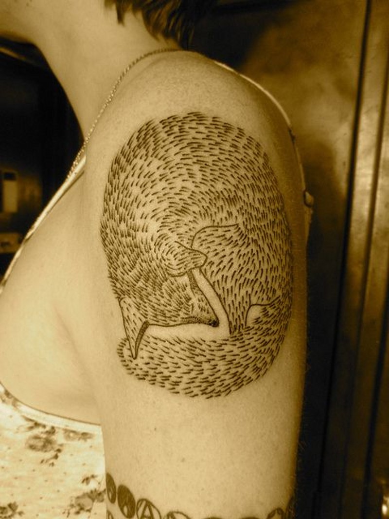 Simple black ink homemade fox tattoo on upper arm