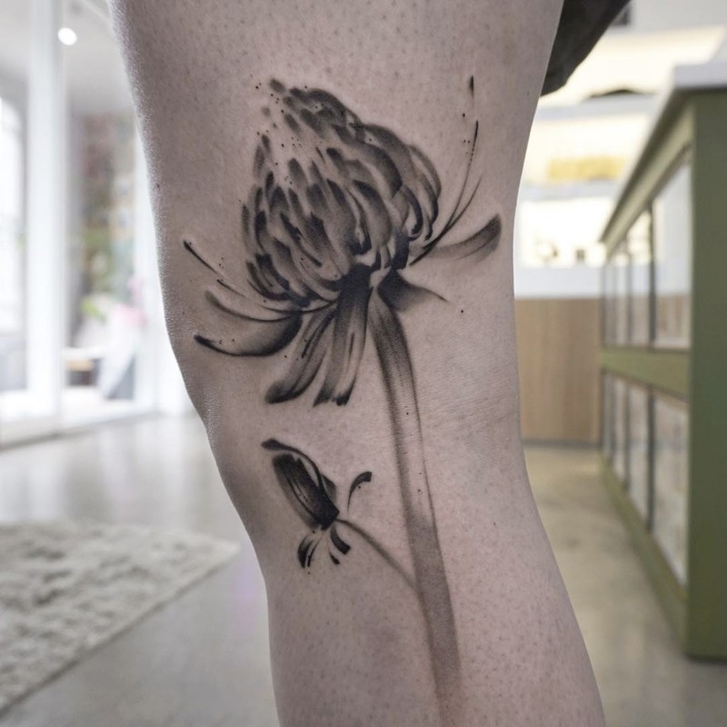 Simple black ink knee tattoo of beautiful flower
