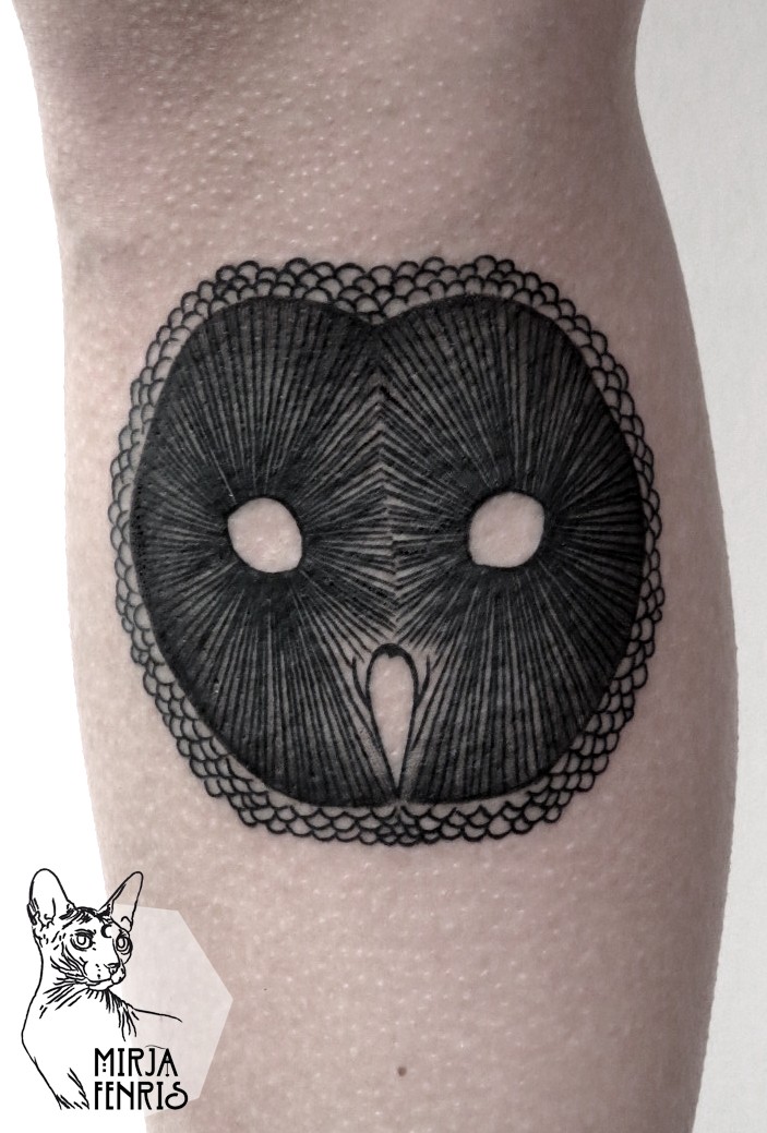 Simple black ink leg tattoo of owl shaped mask