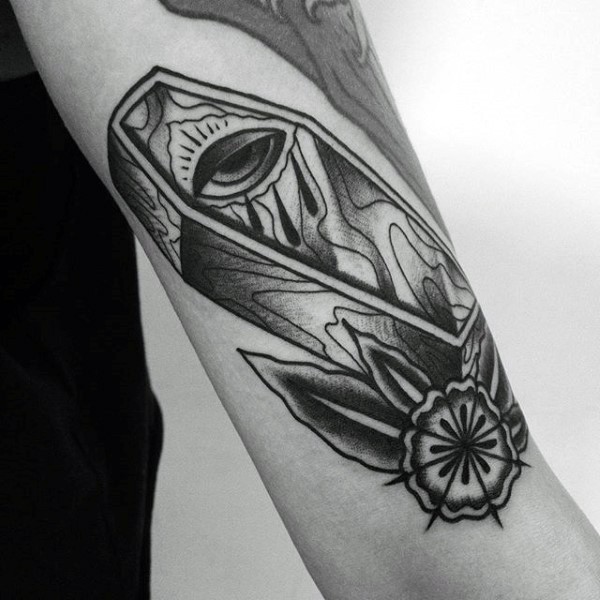 Simple black ink mystic coffin with flower tattoo on arm