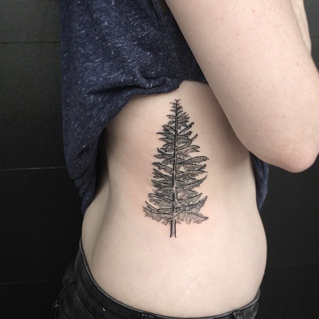 Simple black ink natural looking side tattoo of lonely tree