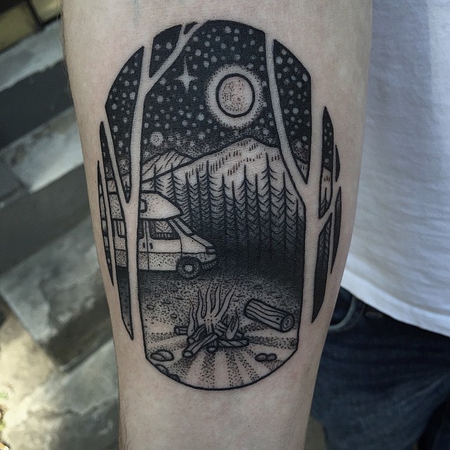 Simple black ink oval shaped tattoo stylized with night sky and camping truck