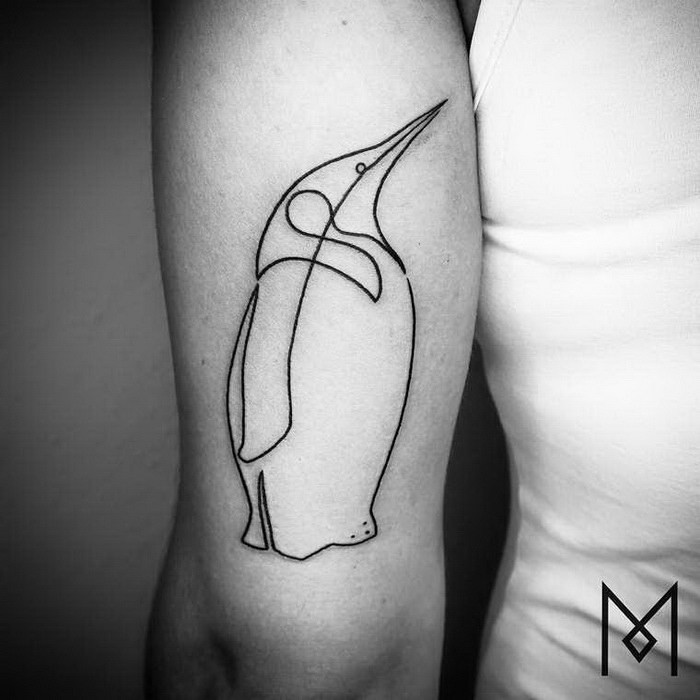 Simple black ink penguin shaped arm tattoo