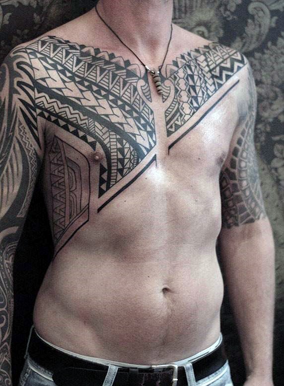 Simple black ink Polynesian style black ink tattoo on chest