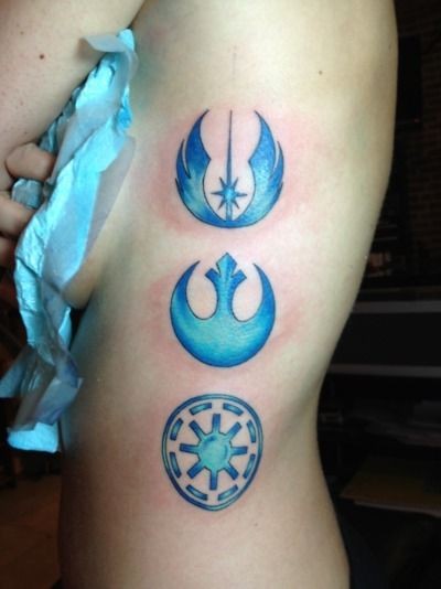 Simple blue colored various Star Wars emblems tattoo on side