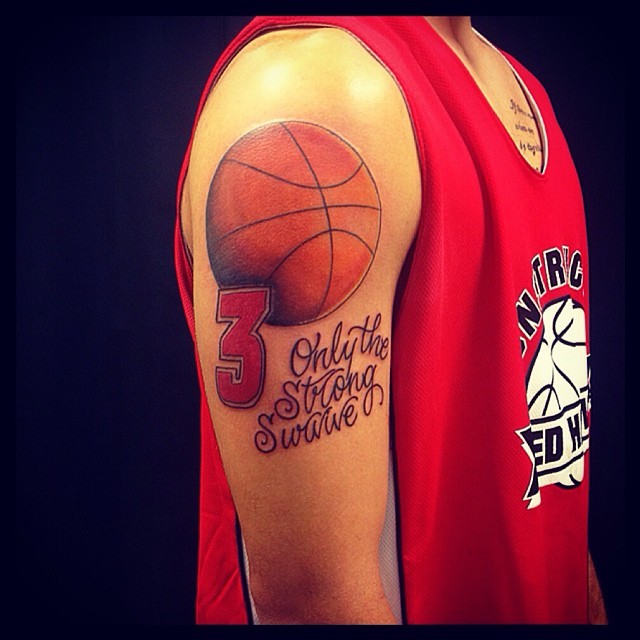 Simple cartoon like colored shoulder tattoo of basketball with lettering and number