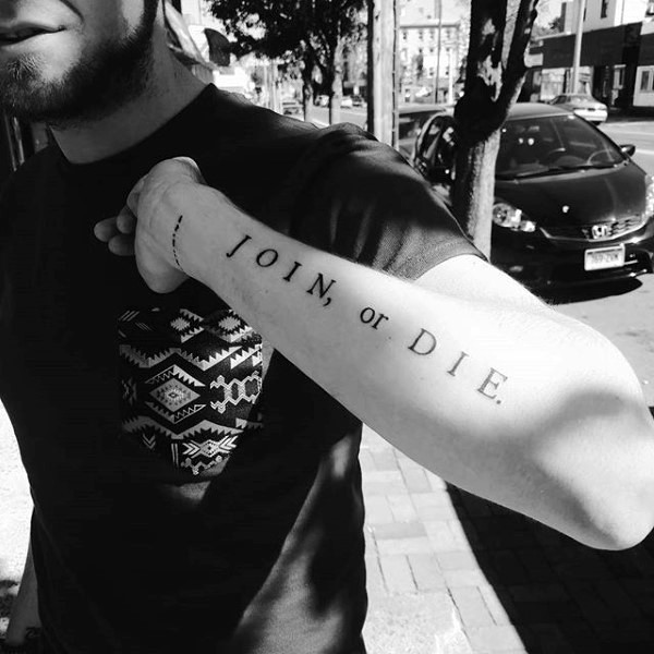 Simple classic join or die lettering tattoo on arm
