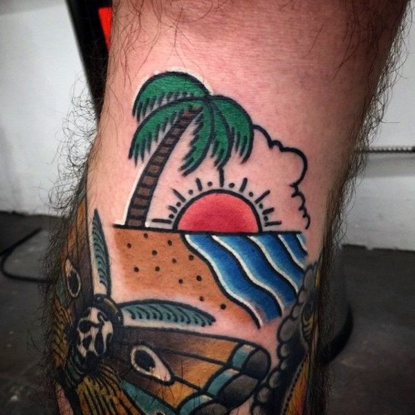 Simple colored palm tree with sun tattoo on leg