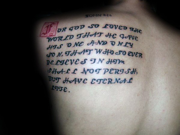 Simple colored scapular tattoo of medieval lettering