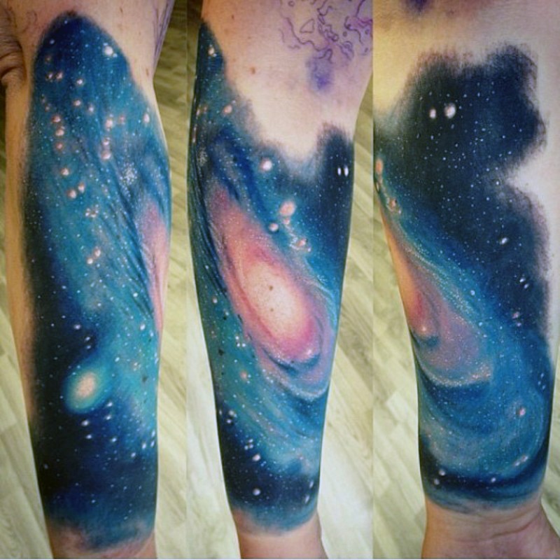 Simple colorful deep space tattoo on arm