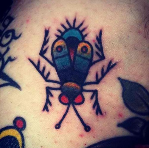 Simple coloured bug tattoo
