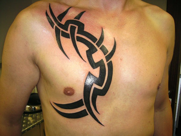 Simple designed big black ink tribal ornament tattoo on chest