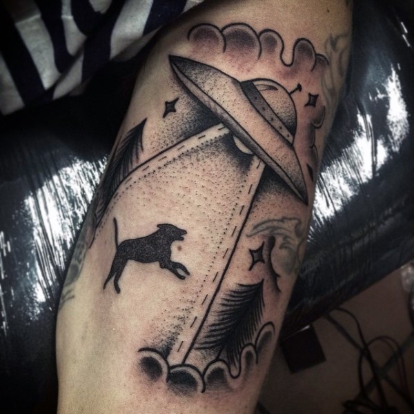 Simple designed black and white alien ship with dog tattoo on arm