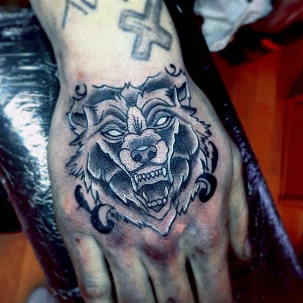 Simple designed black and white evil monster tattoo on hand