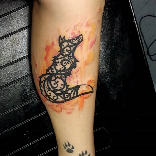 Simple designed black ink tribal fox shaped tattoo on arm combined with flames
